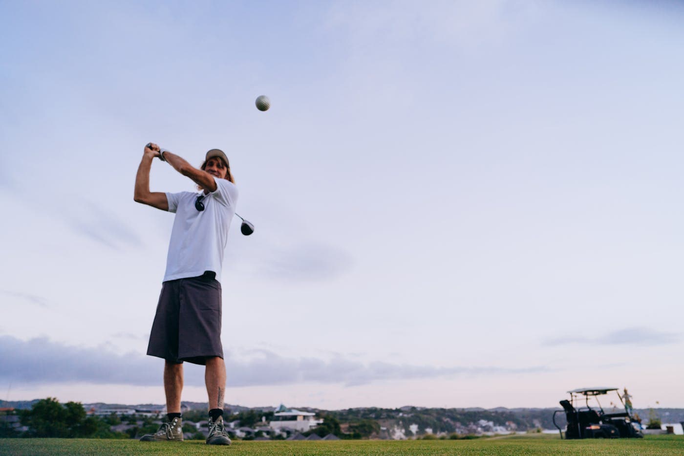 Dad-aged golfer walking off the tee on a UK course